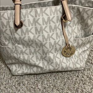 White and Tan Michael Kors purse